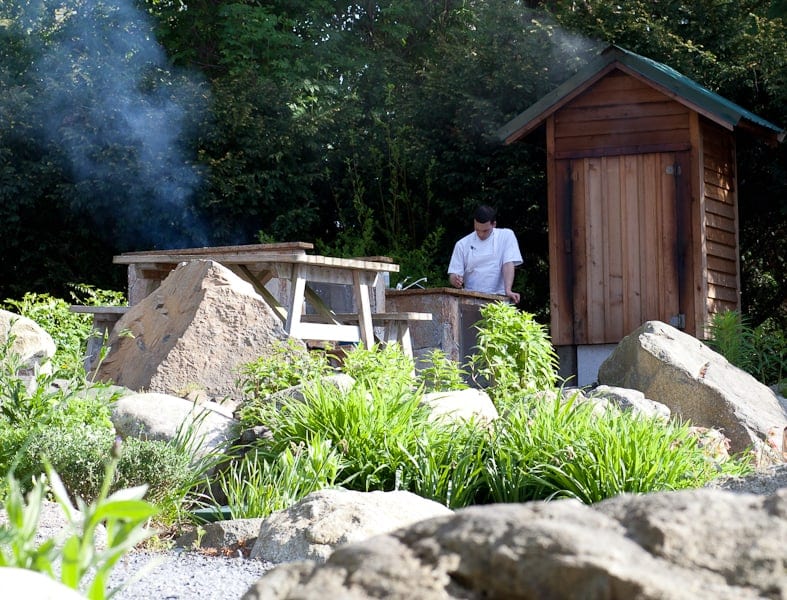 Checking the salmon and trout in the smoker Checking the salmon and trout in the smoker